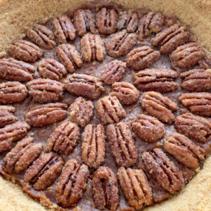 This Healthy Maple Pecan Pie is naturally sweetened and makes a delicious dessert for your table! It can be made vegan and gluten-free with swapping butter for coconut oil and using gluten-free graham crackers or cookies for the pie crust.